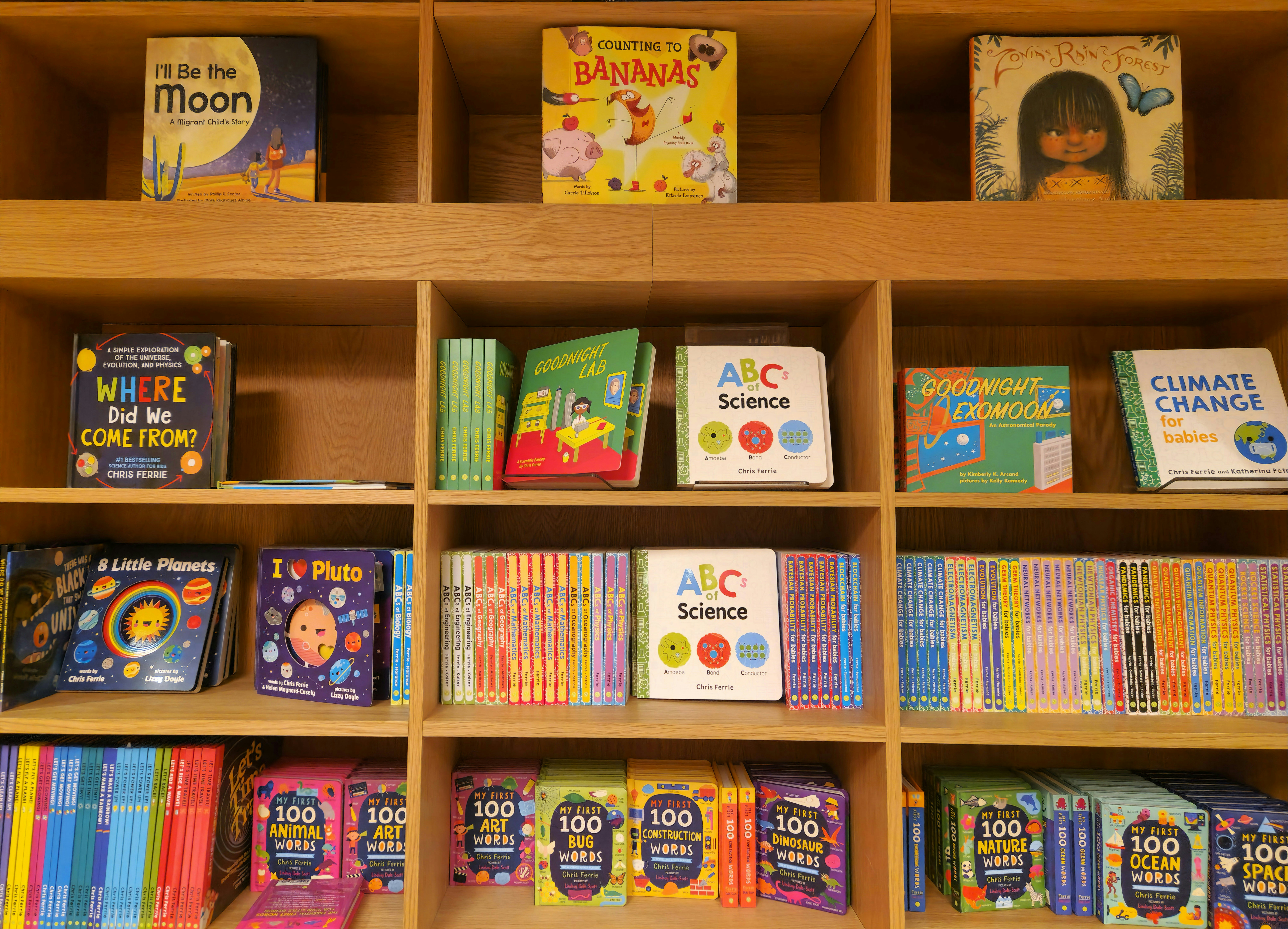 Colorful children's books on a classroom shelf